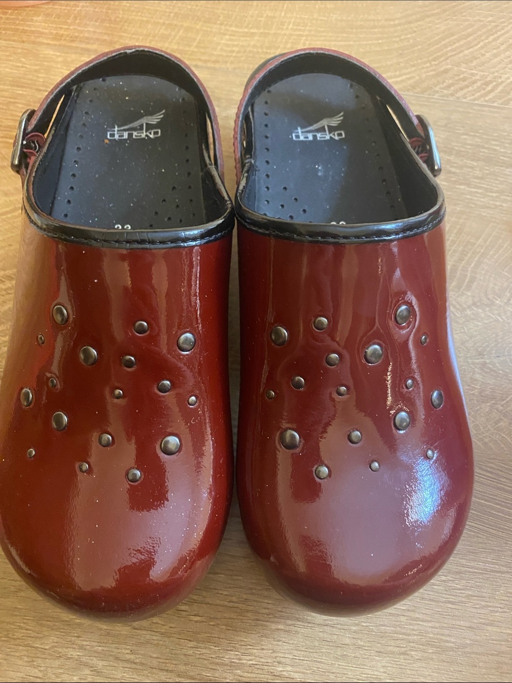 Dansko Burgundy Patent Clogs with Stud Accents